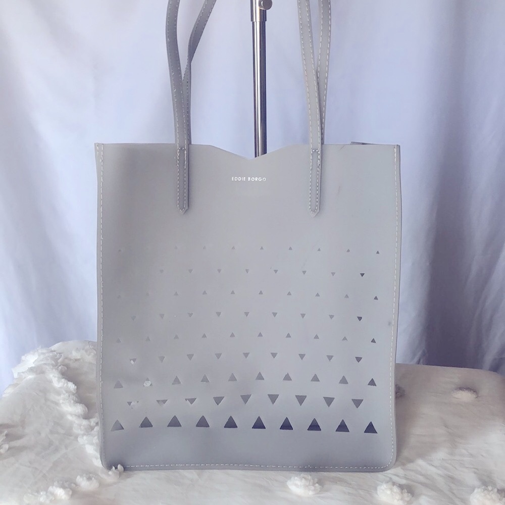 EDDIE BORGO for NEIMAN MARCUS Laser Cut Jelly light gray cosmetic tote.